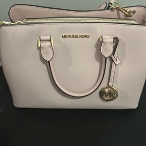 Pink like new Michael Kors purse.